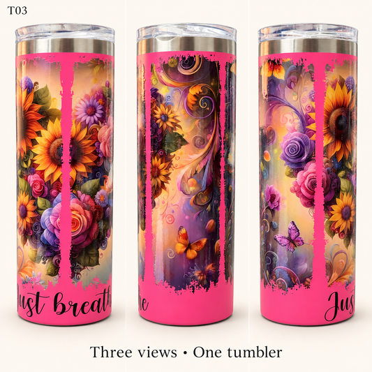 Three views of a tall insulated tumbler with a bright pink base and a colorful floral wrap design featuring sunflowers, roses, butterflies, and swirls. The tumbler has a clear lid and metallic rim, and the text 'Just breathe' is printed near the bottom.