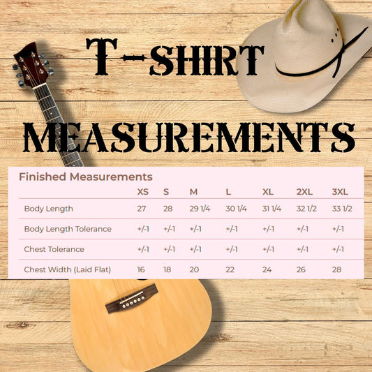 T-shirt measurement chart with guitar and cowboy hat on wooden background