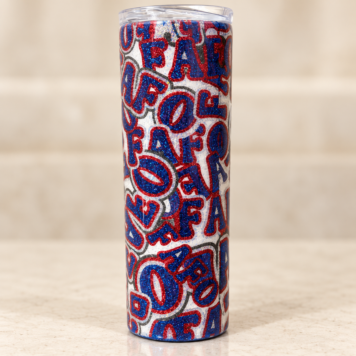20 oz epoxy tumbler with blue glitter FAFO lettering, red outlines and a white-and-silver glitter background.