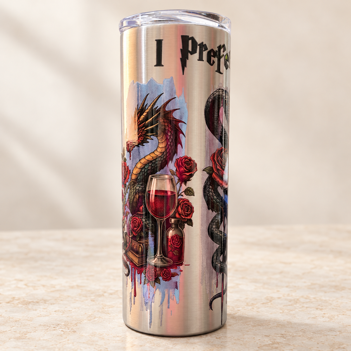 Stainless steel 20 oz I Prefer the Villain tumbler with dragon, snake, rose, and book artwork.